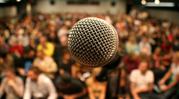 Microphone in front of a live audience